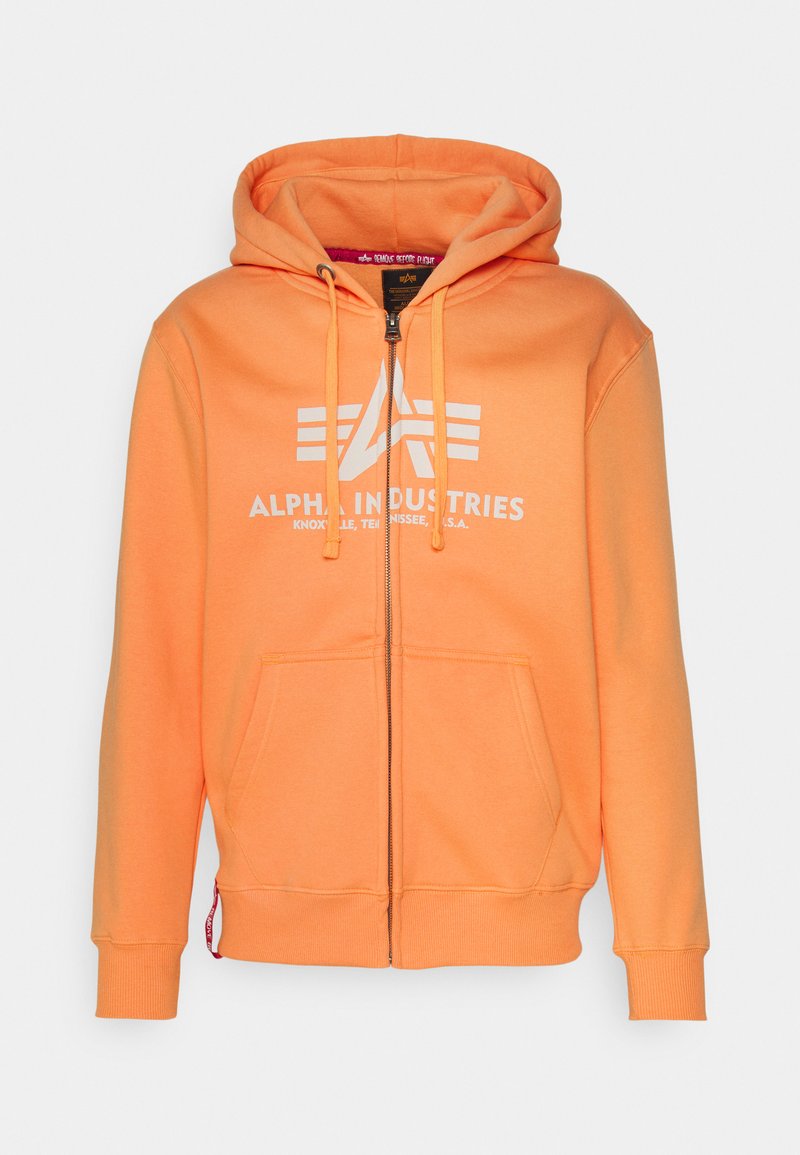 Orange Kapuzenpullover mit Reißverschluss aus strukturiertem Stoff. Verfügt über eine vordere Tasche, eine Zugkordelkapuze und ein aufgedrucktes Logo auf der Brust.