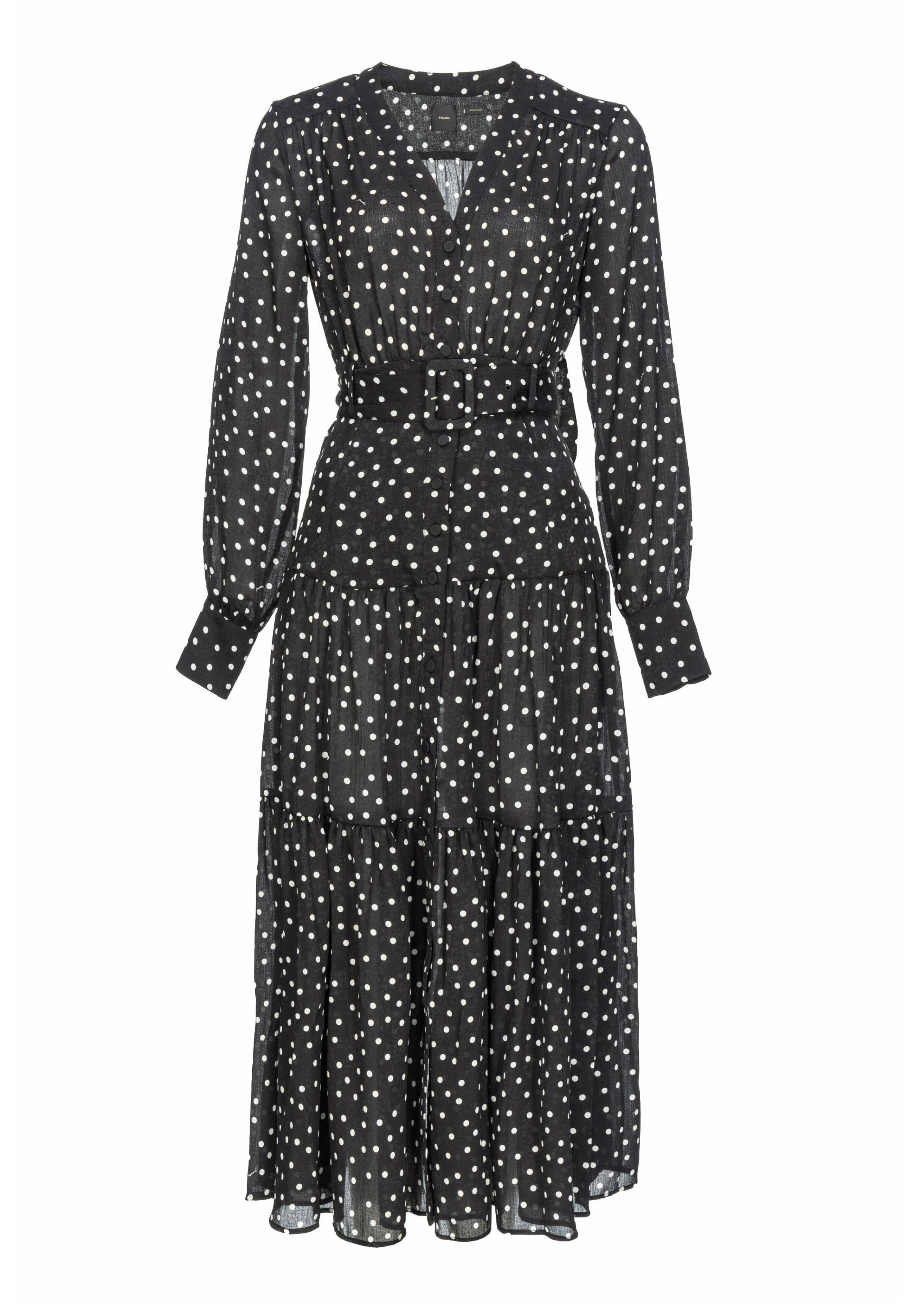 Schwarzes Midikleid mit weißen Pünktchen, langen Ärmeln, Knopfleiste, tailliertem Bund und gestuftem Rockdesign. Leichtes, durchsichtiges Material.
