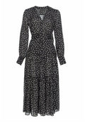 Schwarzes Midikleid mit weißen Pünktchen, langen Ärmeln, Knopfleiste, tailliertem Bund und gestuftem Rockdesign. Leichtes, durchsichtiges Material.