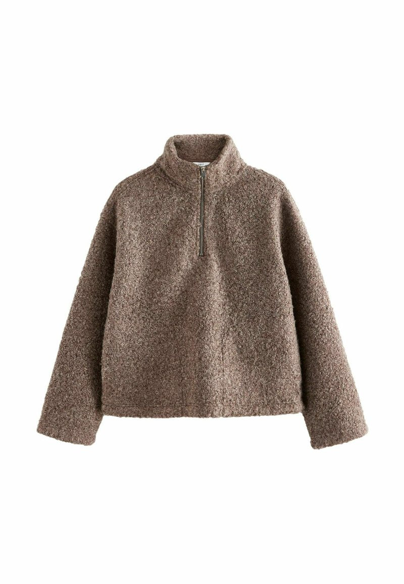 Brauner Fleece-Pullover mit hohem Kragen und halbem Reißverschluss. Verfügt über eine strukturierte Oberfläche und eine lockere Passform.