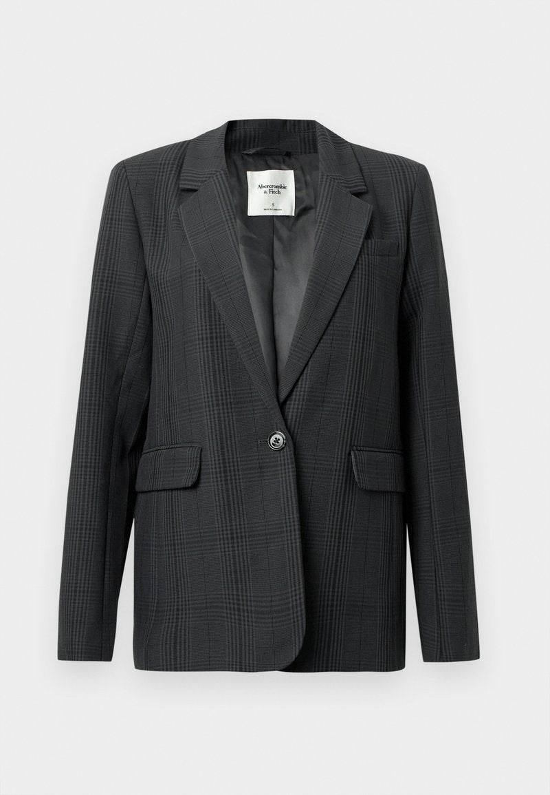 Dunkelgrauer karierter Blazer mit Reverskragen, einfacher Knopfverschluss und Fronttaschen. Glattes Gewebe mit einer subtilen Textur. Gefüttertes Innere.