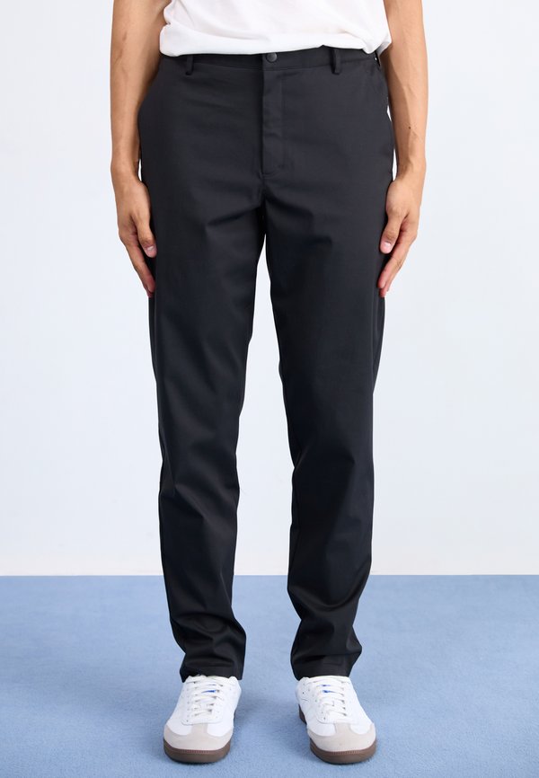 New Balance ATHLETICS STANDARD TAPERED PANT  - Trousers - black