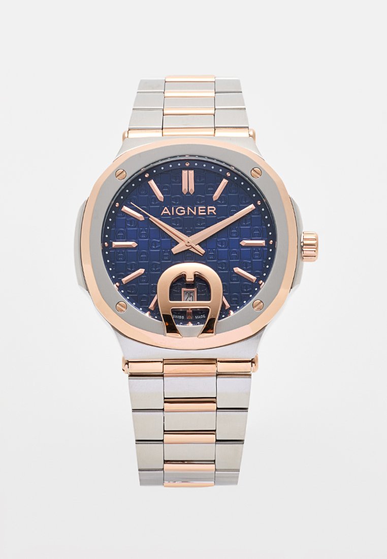 Aigner-Uhr mit strukturiertem navy-blauen Zifferblatt, roségoldenen Akzenten, silbernem Edelstahlarmband und einem Datumsdisplay um 6 Uhr.