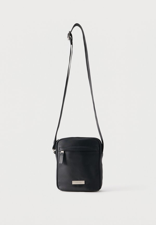Calvin Klein CLEAN REPORTER - Cross body bag - black