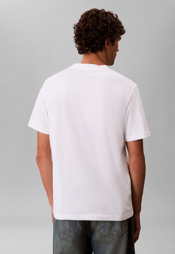 Calvin Klein WHOLESALE SPORTSWEAR GRAP GRAPHIC TEE