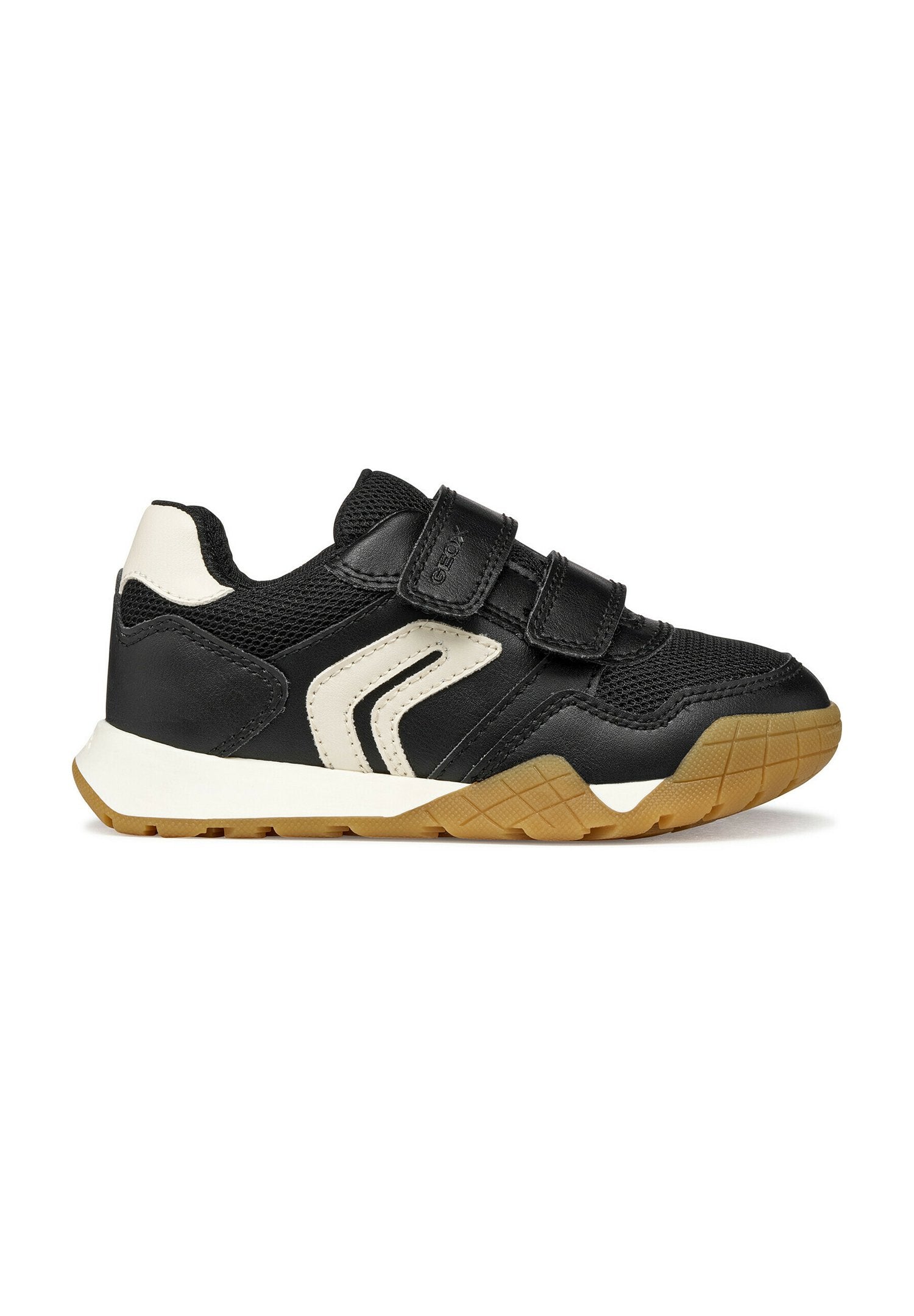 Schwarz-weißer Kindersneaker mit Klettverschlüssen, Obermaterial aus Mesh und Leder sowie einer strukturierten braunen Gummisohle.
