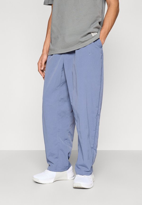 Nike Performance M NK DF NAC WOVEN PANT - Trousers - diffused blue/pale ivory