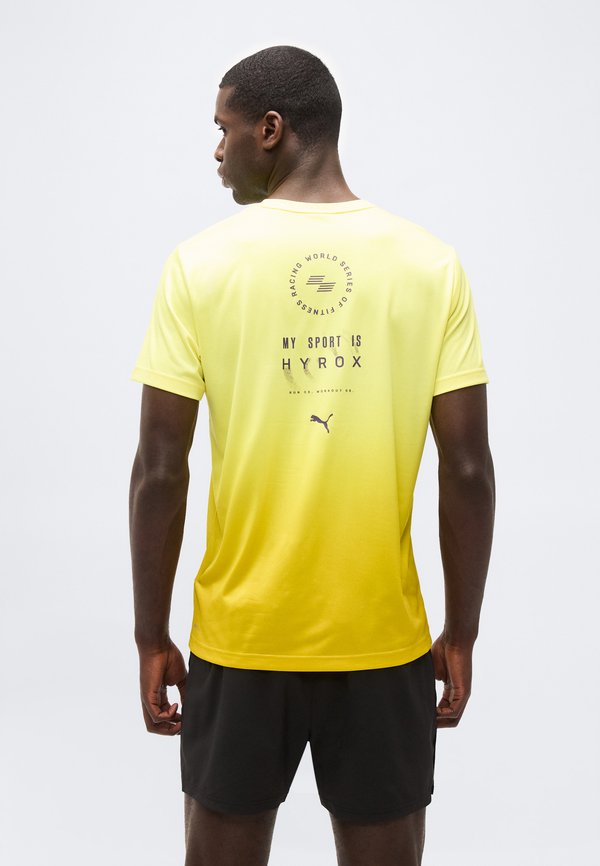Puma PUMA X HYROX GRAPHIC TEE - Sports T-shirt - pineapple ice/dazzling yellow