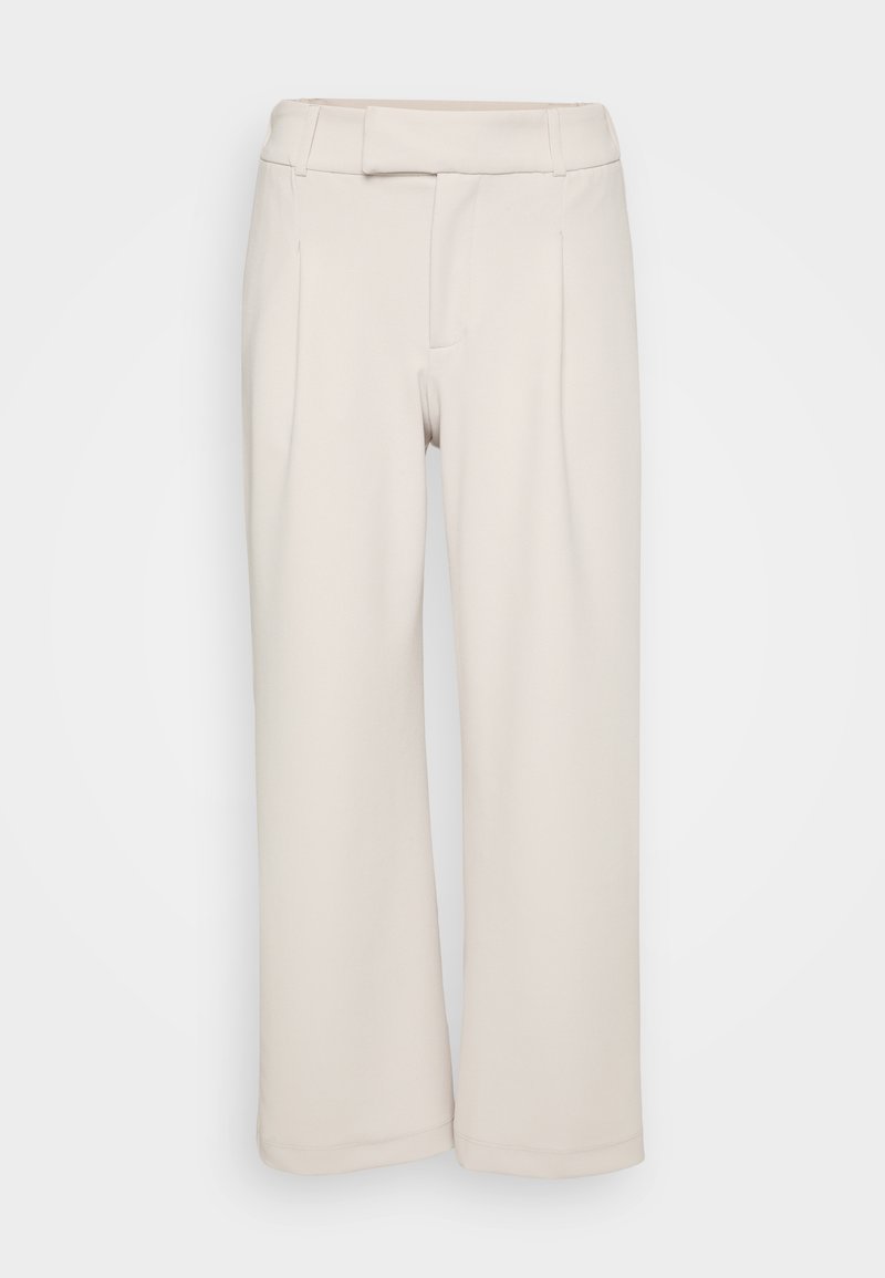 Beige weite Hosen aus weichem Stoff mit glatter Textur. Mit einem flachen Bund und zwei vorderen Falten.