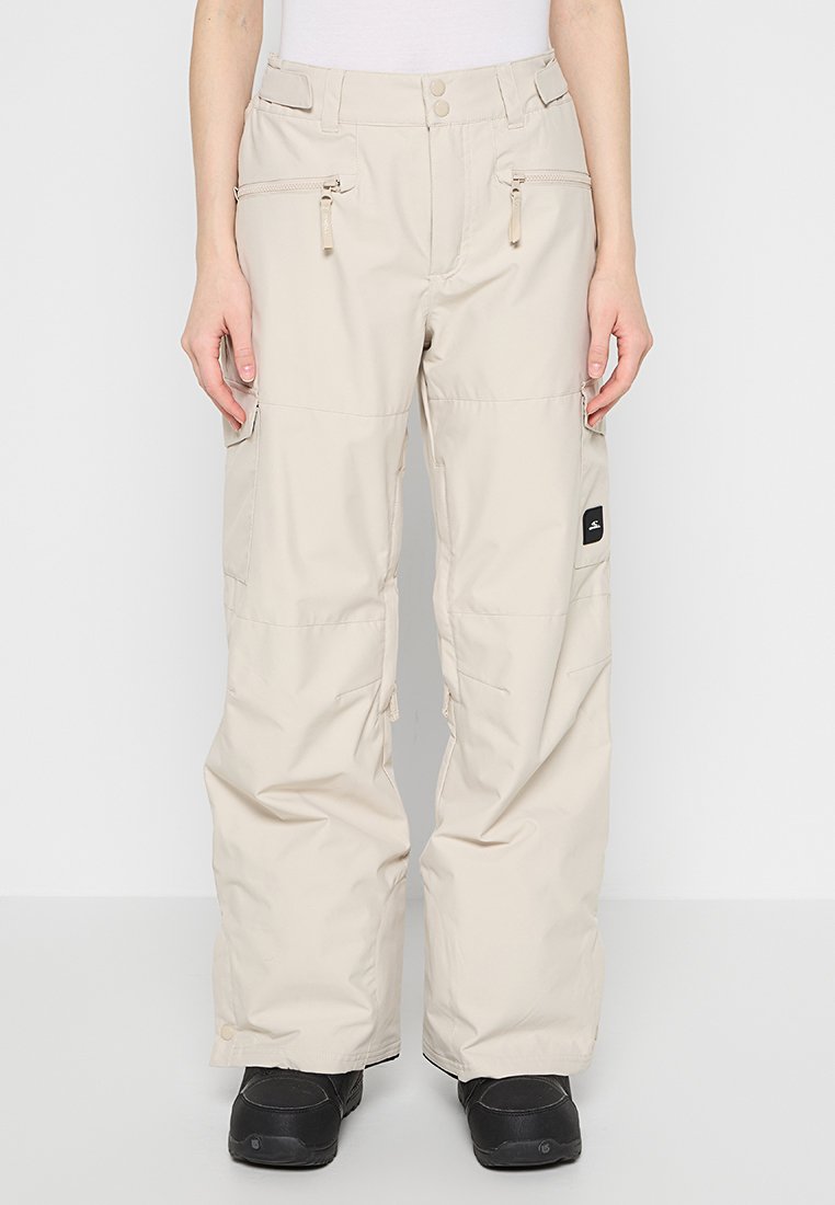Beige Snowboardhosen mit Reißverschlusstaschen, einer lockeren Passform und Verstärkungen am Saum. Hergestellt aus strapazierfähigem, wetterfestem Material.