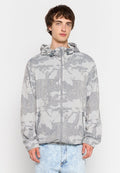 Leichte, grau zip-up Jacke mit einem strukturierten, abstrakten Muster. Mit Kapuze, elastischen Bündchen und zwei Seitentaschen.