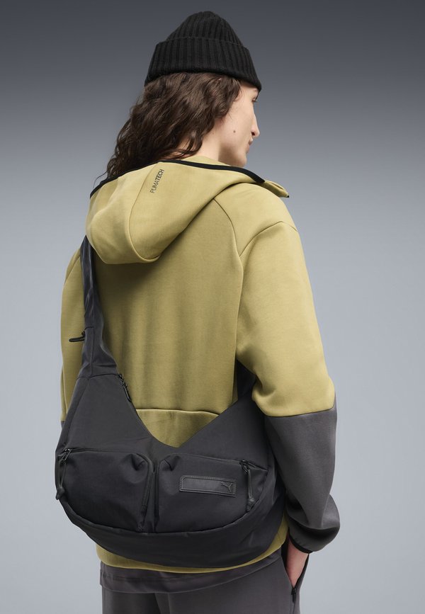 Puma PUMA.BL 15 L MITTELGROSSE HOBO-BAG UNISEX - Cross body bag - black