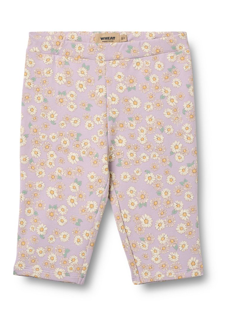 Lila Leggings mit floralem Muster, das weiße Gänseblümchen und grüne Blätter zeigt. Elastischer Bund, weicher Stoff und verkürzte Länge.
