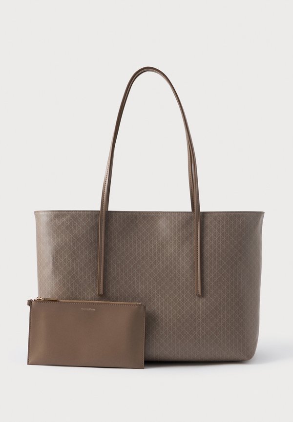 Calvin Klein COATED EMBLEM - Handbag - desert taupe