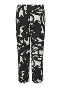 Schwarz-weiße gemusterte Weitbein-Hosen mit einem elastischen Bund, die abstrakte Formen und einen glatten, leichten Stoff aufweisen.