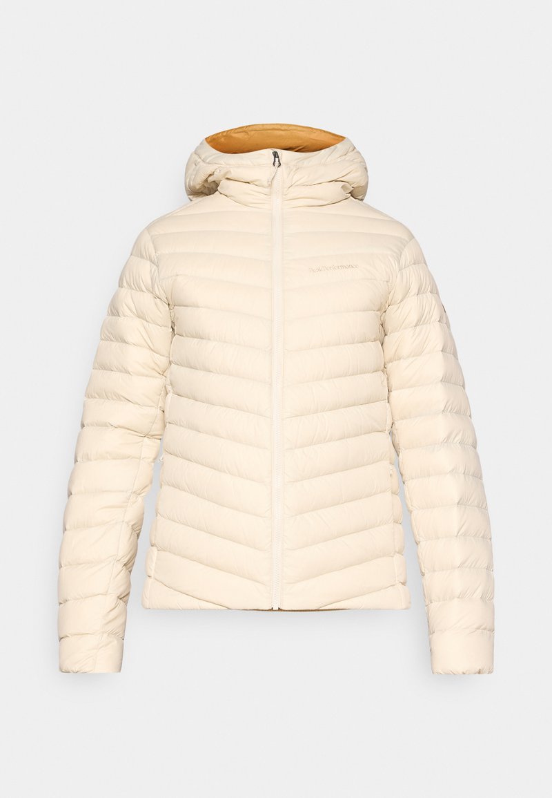 Dünne Jacke in hellem Creme mit einem Rautenmuster, Kapuze und Reißverschluss. Das Innenfutter hat ein kontrastierendes warmes orangefarbenes Design.