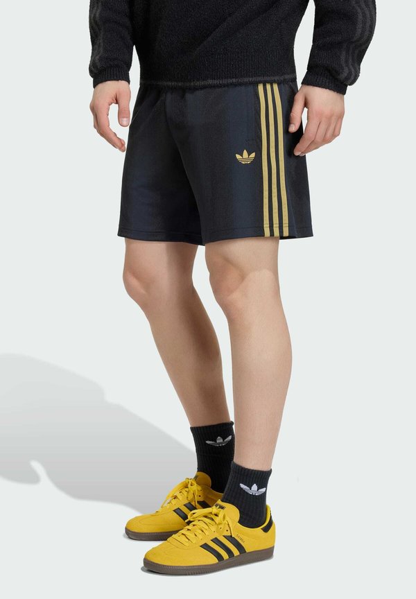 adidas Originals Tracksuit bottoms - black/dark football gold-coloured
