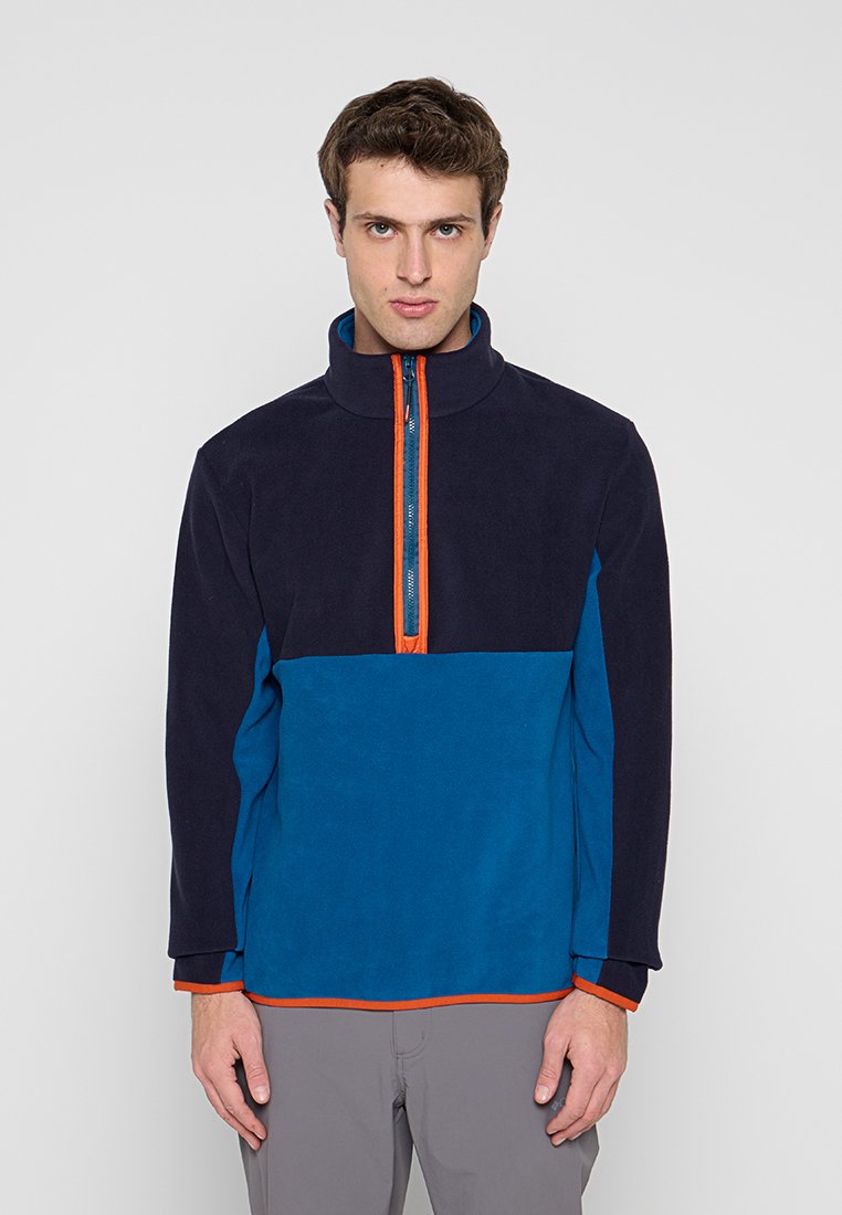 Fleecepullover in Dunkelblau und Türkis mit orangem Reißverschluss und Besatz. Kragen-Design mit langen Ärmeln und lockerer Passform.