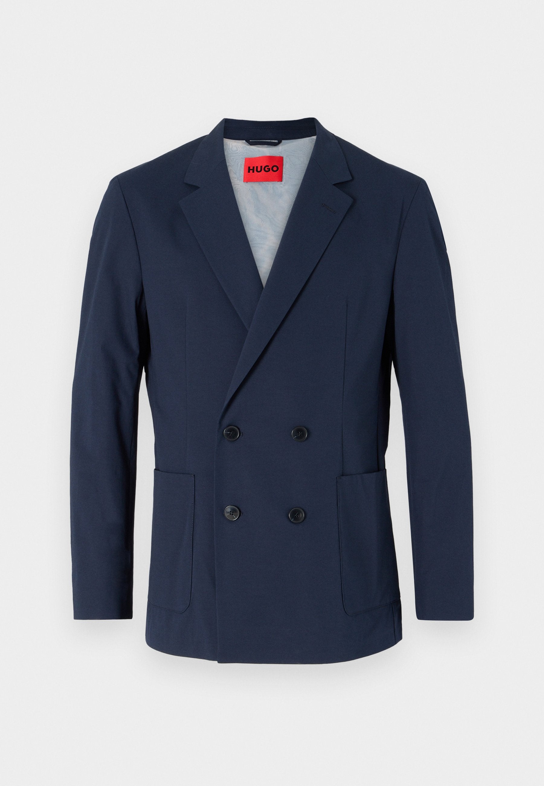 Marineblaues, doppelt geknöpftes Blazer mit spitzem Revers, zwei vorderen Taschen und schwarzen Knöpfen. Das Innenfutter ist hellblau.