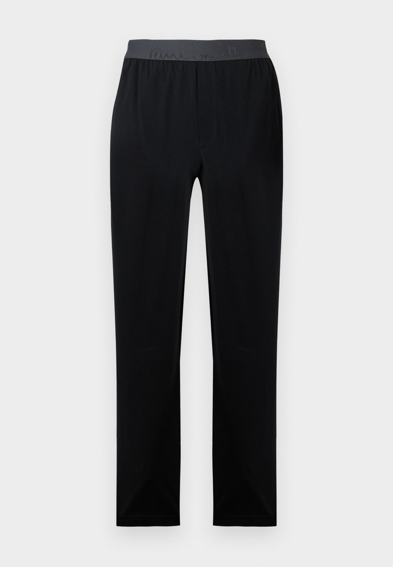 Schwarze lange Hose aus weichem Stoff mit elastischem Bund und einem dezenten grauen Logo. Gerade Beinführung ohne Verzierungen.