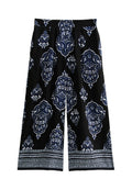 Schwarze Culotte-Hosen mit einem blauen ornamentalen Paisleymuster, weichem Stoff, weit geschnittenem Bein und einem gemusterten Saum.