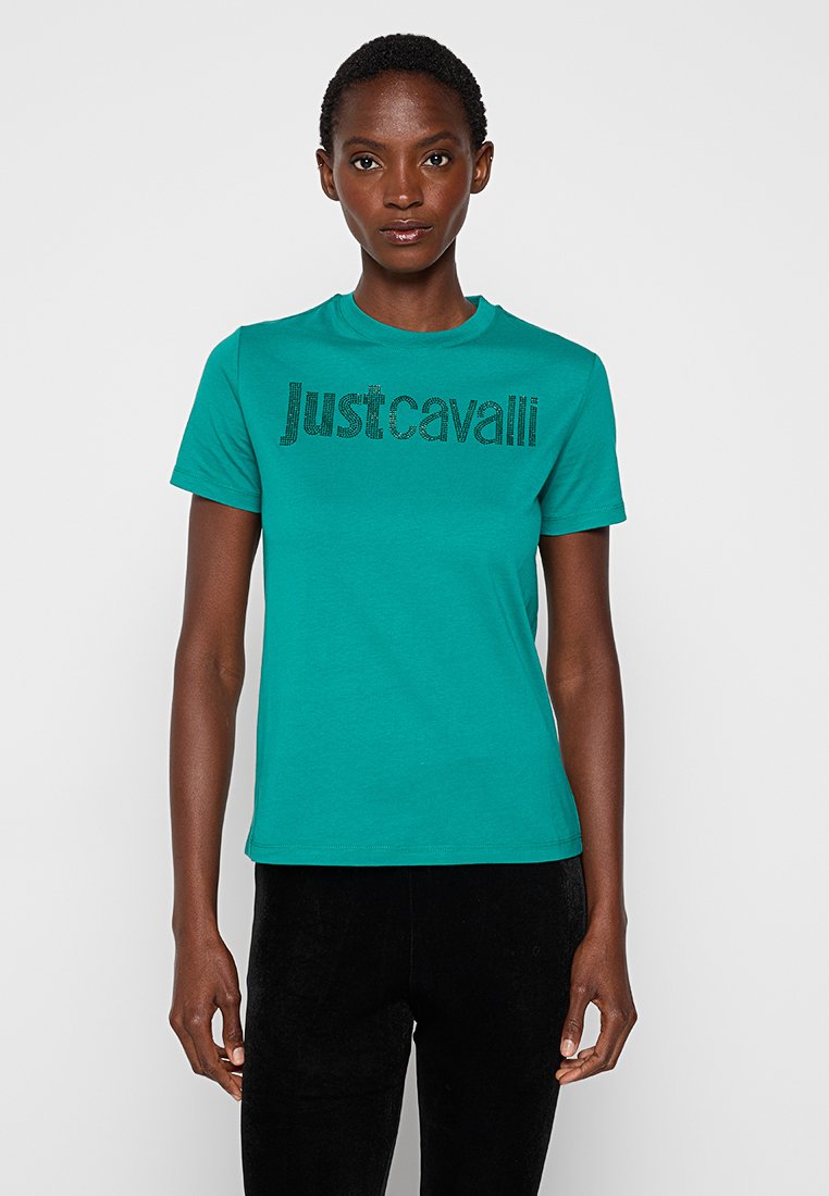 Türkises Baumwoll-T-Shirt mit Rundhalsausschnitt, kurzen Ärmeln und schwarzem "Just Cavalli"-Logo mit strukturiertem Design. Gerade geschnittener Saum.