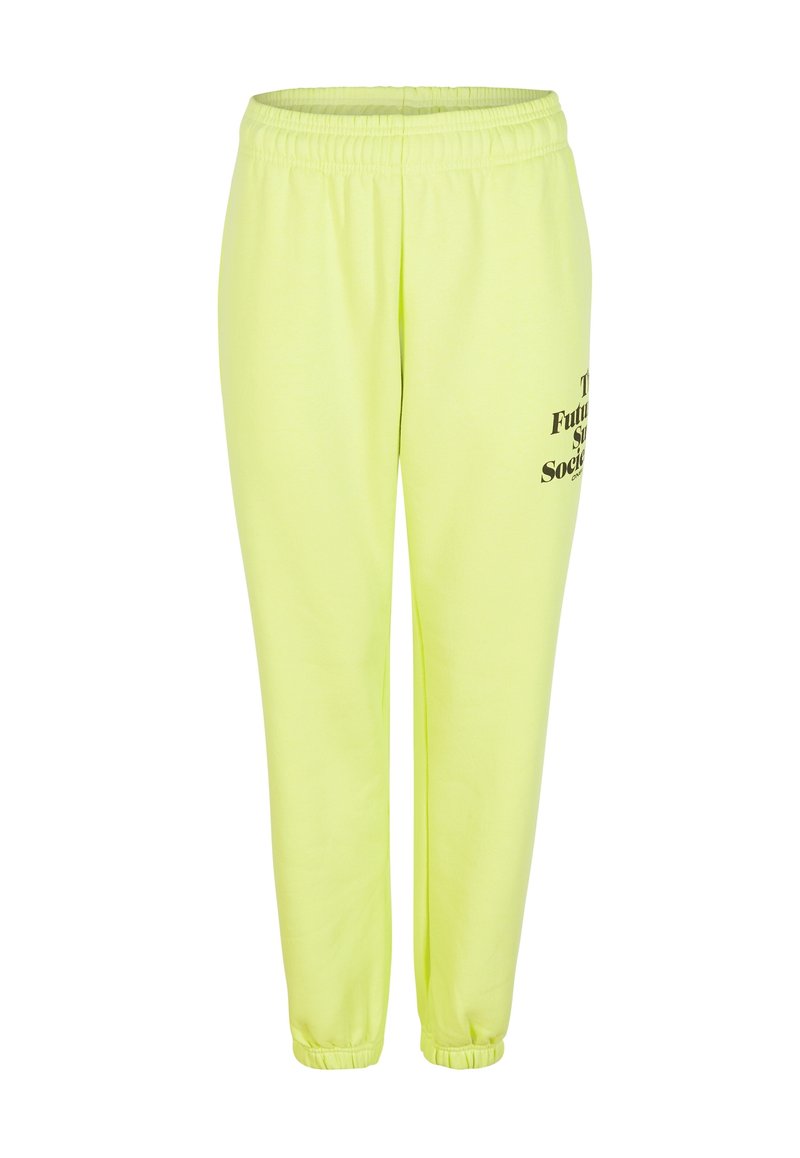 Neon-gelbe Jogginghose mit elastischem Bund und Bündchen. Mit schwarzem Drucktext am linken Bein. Hergestellt aus weichem, strukturiertem Stoff.
