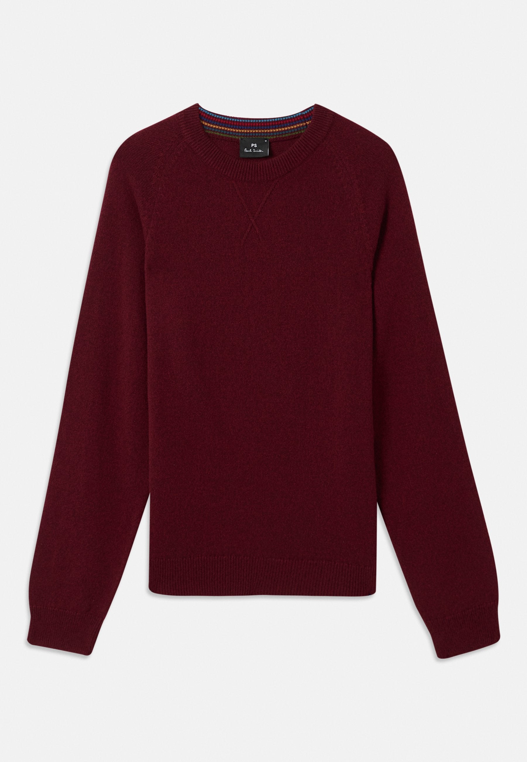 Burgunderfarbener Pullover mit Rundhalsausschnitt, langen Ärmeln und gerippten Bündchen. Hergestellt aus weichem Material mit einer strukturierten Oberfläche und dezenten Nähten.