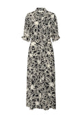 Schwarz-weißer Blumendruckkleid mit Kragen, Knopfverschluss und Bindegürtel in der Taille. Lange Ärmel mit gerafften Manschetten.
