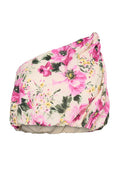 Schulterfreie bauchfreie Bluse mit rosa-grünem Blumenmuster auf hellbeigem Hintergrund, elastischem Saum und Halsausschnitt.