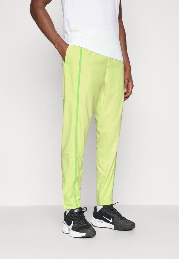 Nike Performance HERITAGE  - Tracksuit bottoms - light liquid lime/mean green