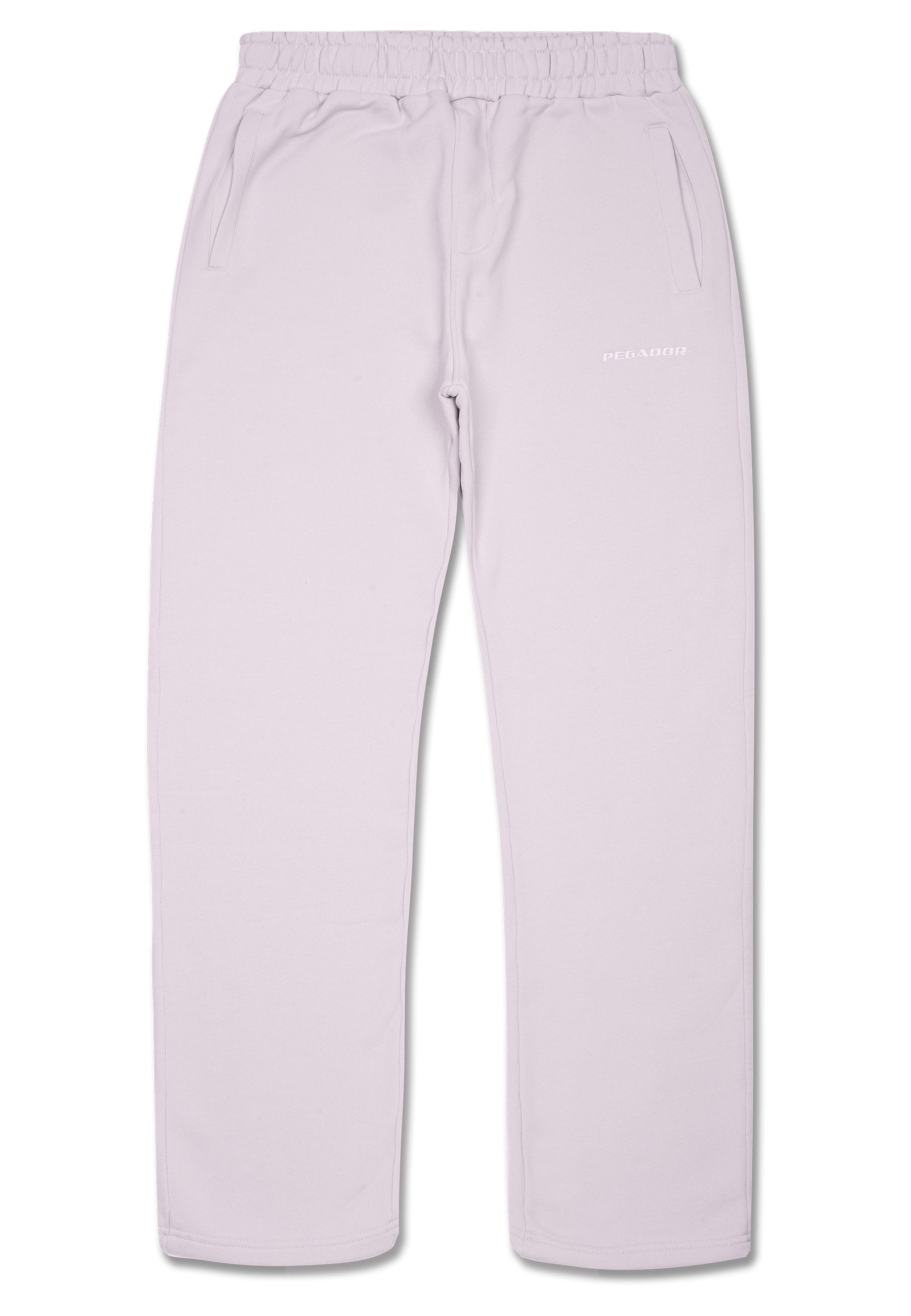 Helllila Jogginghose aus weichem Material, mit einem elastischen Bund, zwei Eingrifftaschen und einem kleinen gedruckten Logo am Bein.