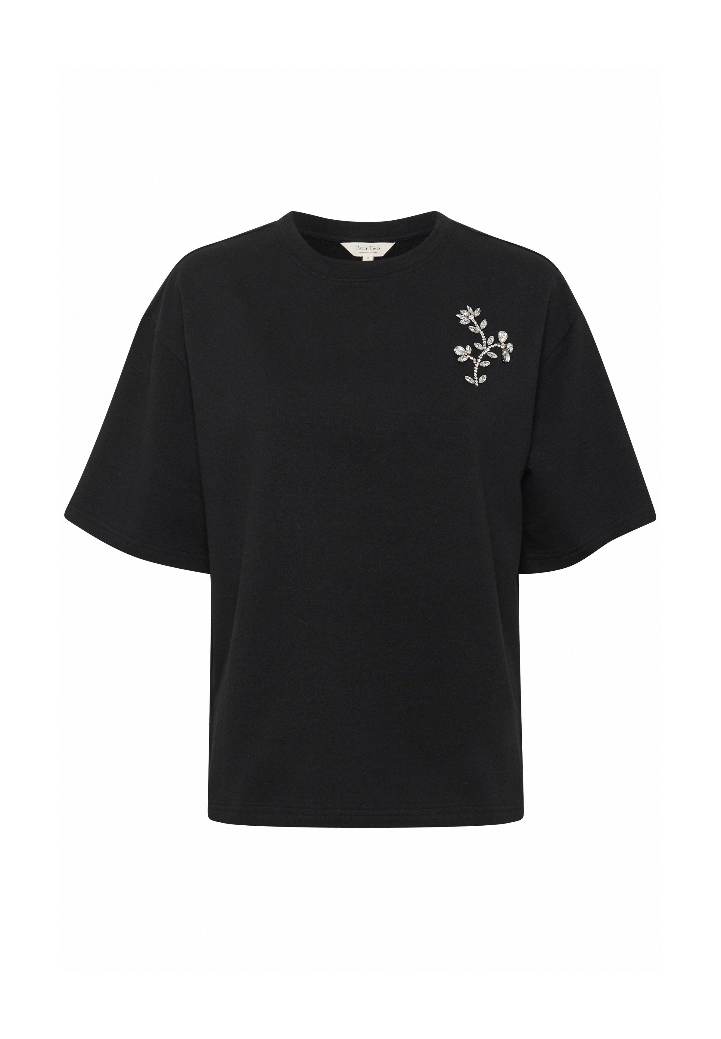 SchwarzKurzarm-T-Shirt mit lockerer Passform, das ein florales Stickdesign auf der linken Seite in der Nähe der Brust hat.