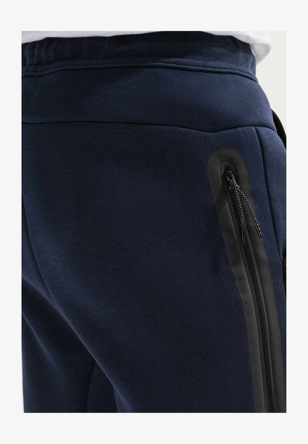 Nike Sportswear M NK TCH FLC JGGR - Tracksuit bottoms - obsidian black bright violet