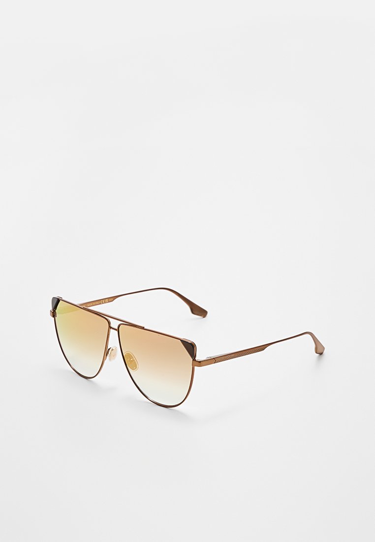 Bronzefarbene Metall-Flieger-Sonnenbrille mit gradienten gelben Gläsern, die ein elegantes Design, einen dünnen Rahmen und strukturierte Bügel für besseren Halt aufweist.