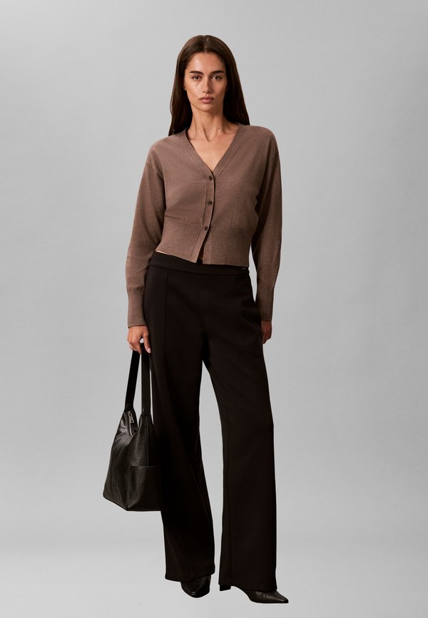 Calvin Klein POCKETS MONOLOGO L - Handbag - black