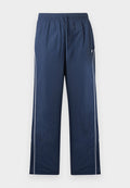 Marineblaue Jogginghose mit elastischem Bund, Kordelzug, weißer Seitenpaspel und kleinem Logo auf der oberen linken Seite.