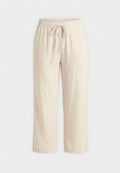 Beige Hosen mit weitem Bein, elastischem Bund und vorderem Tunnelzug, gefertigt aus leichtem Stoff, auf weißem Hintergrund dargestellt.