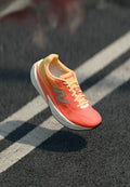 New Balance FUELCELL REBEL V5 - Road running shoes - tangerine heat