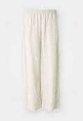 Leinen-Hosen mit weitem Bein in Off-White, ausgestattet mit einem elastischen Bund, der eine atmungsaktive Textur und gerade geschnittene Beine bietet.
