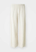 Leinen-Hosen mit weitem Bein in Off-White, ausgestattet mit einem elastischen Bund, der eine atmungsaktive Textur und gerade geschnittene Beine bietet.
