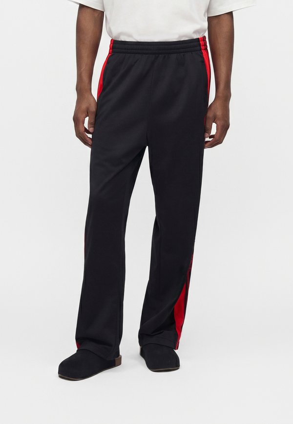 adidas Originals ADIBREAK - Tracksuit bottoms - black/vivid red