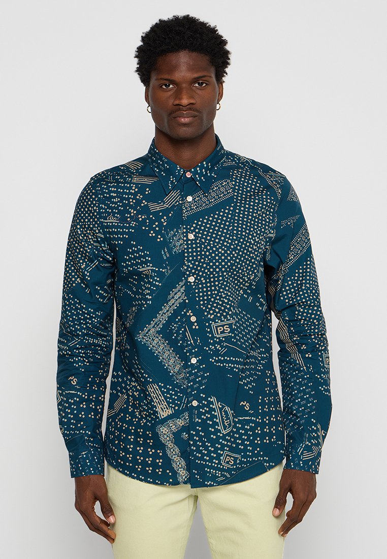 Dunkelblaues Hemd mit geometrischem Muster in Creme. Mit Kragen, langen Ärmeln und einem Stoff mit glatter Textur.