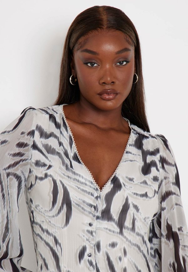 Guess ZEBRA