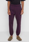 Lila Jogginghosen mit elastischem Bund und Bündchen an den Knöcheln. Hergestellt aus weichem Material, mit lockerem Schnitt und minimalistischem Design.