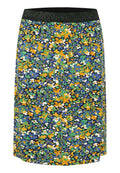 Rock mit Blumenmuster in Blau, Grün, Gelb und Weiß, mit einem schwarzen Glitzerbund; aus leichtem, weichem Stoff hergestellt.