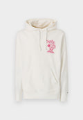 Cremfarbener Hoodie aus weichem Material, mit einer Kängurutasche und einem pinkfarbenen Grafikdesign mit Text auf der Vorderseite. Mit Kordelzügen an der Kapuze.