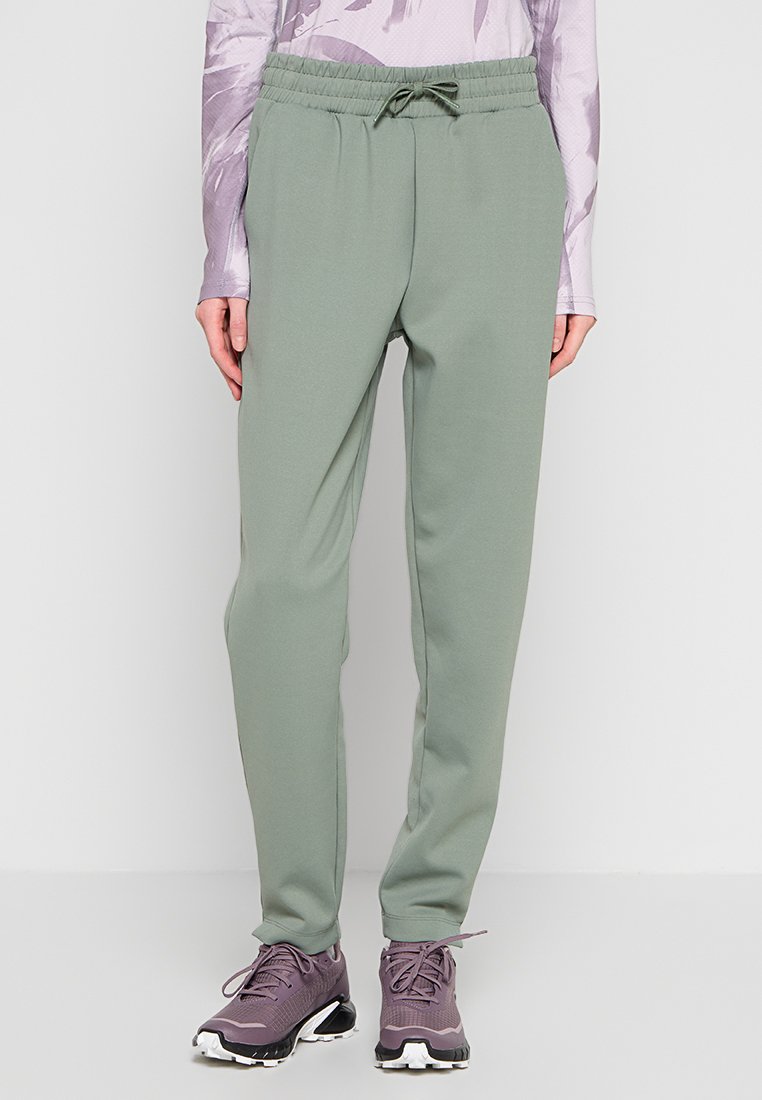 Hellgrüne Sporthose aus weichem Stoff, mit elastischem Bund und Kordelzug sowie zulaufenden Beinen. Keine sichtbaren Taschen.