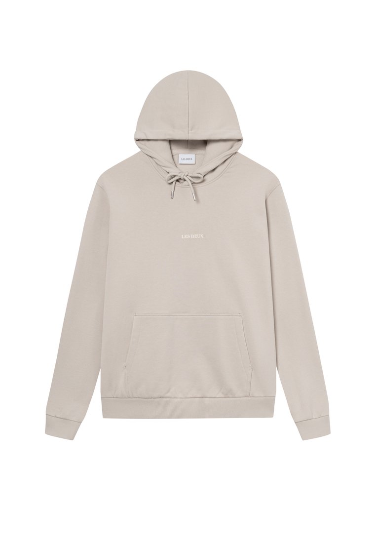 Beige Pullover-Hoodie aus weichem Baumwollmix. Verfügt über eine Kapuze mit Kordelzug, eine Vorderasche, gerippte Bündchen und minimale Markenbeschriftung.