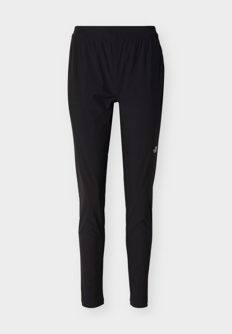 Schwarze Sporthose mit elastischem Bund, schlanker Passform und kleinem weißen Logo am oberen Oberschenkel vor weißem Hintergrund.